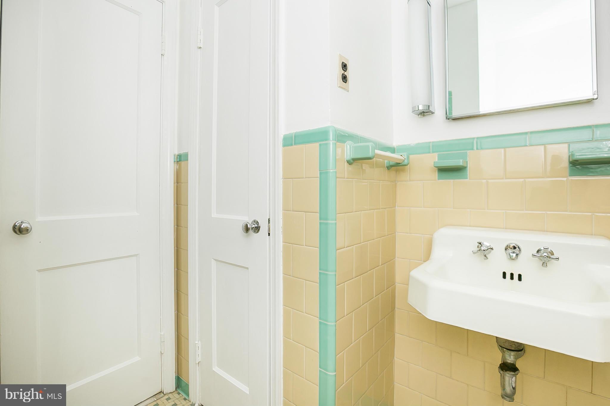 3301 Marnat Road Baltimore, MD 21208 - Photo 21 of 27 a bathroom with a bathtub and a sink