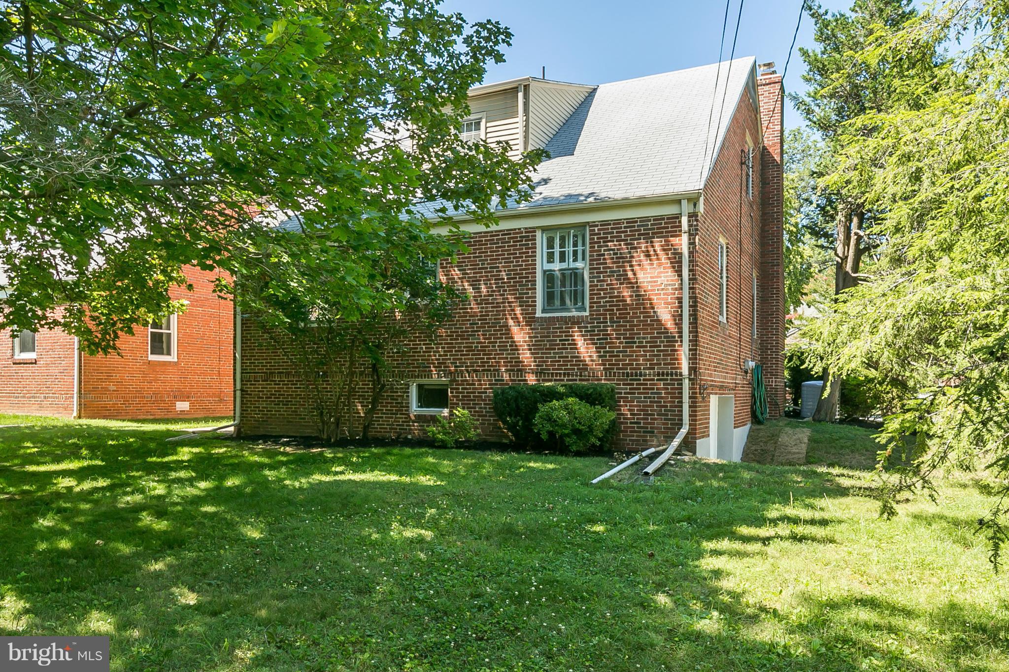 3301 Marnat Road Baltimore, MD 21208 - Photo 26 of 27 front view of a house with a yard