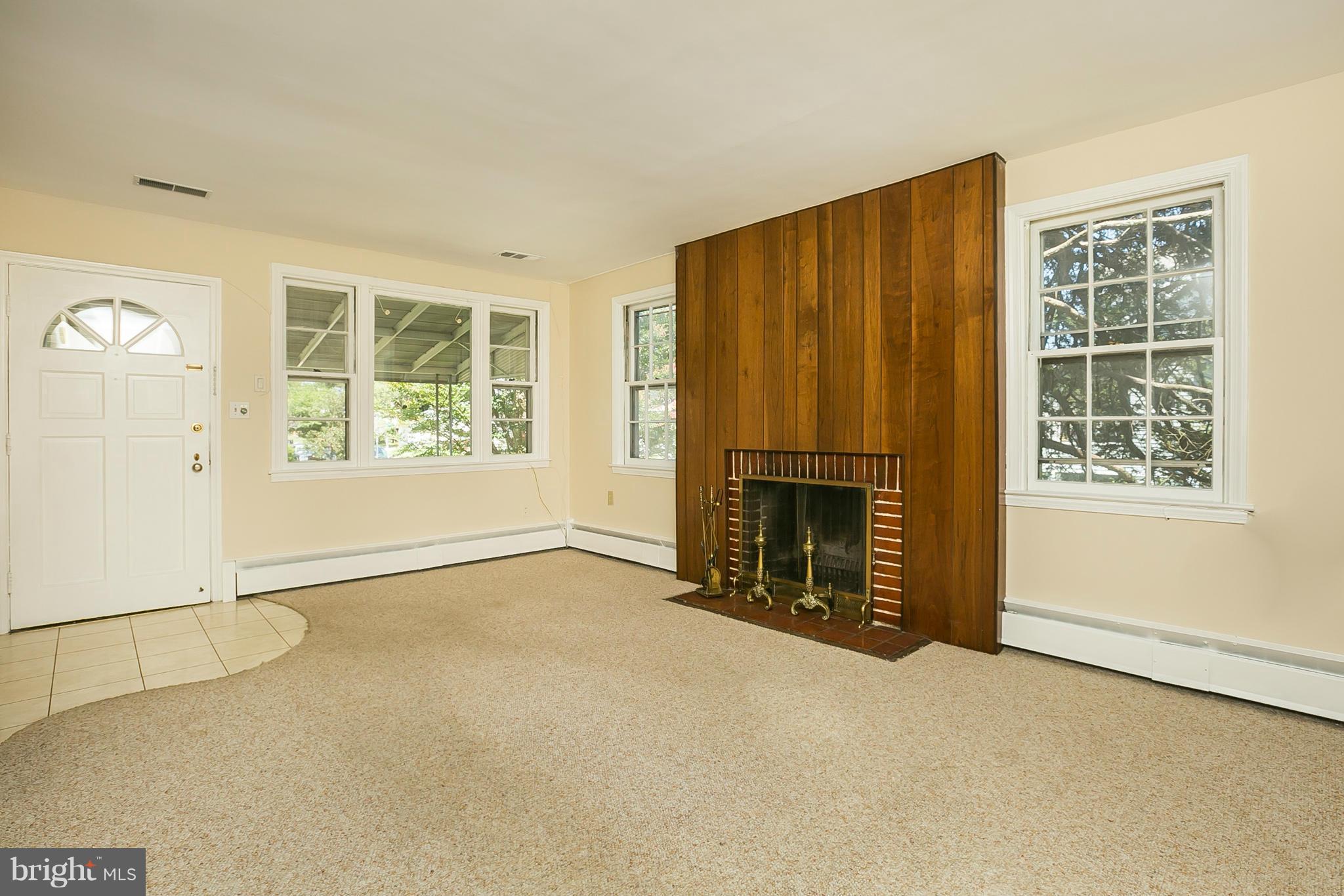 3301 Marnat Road Baltimore, MD 21208 - Photo 4 of 27 an empty room with windows
