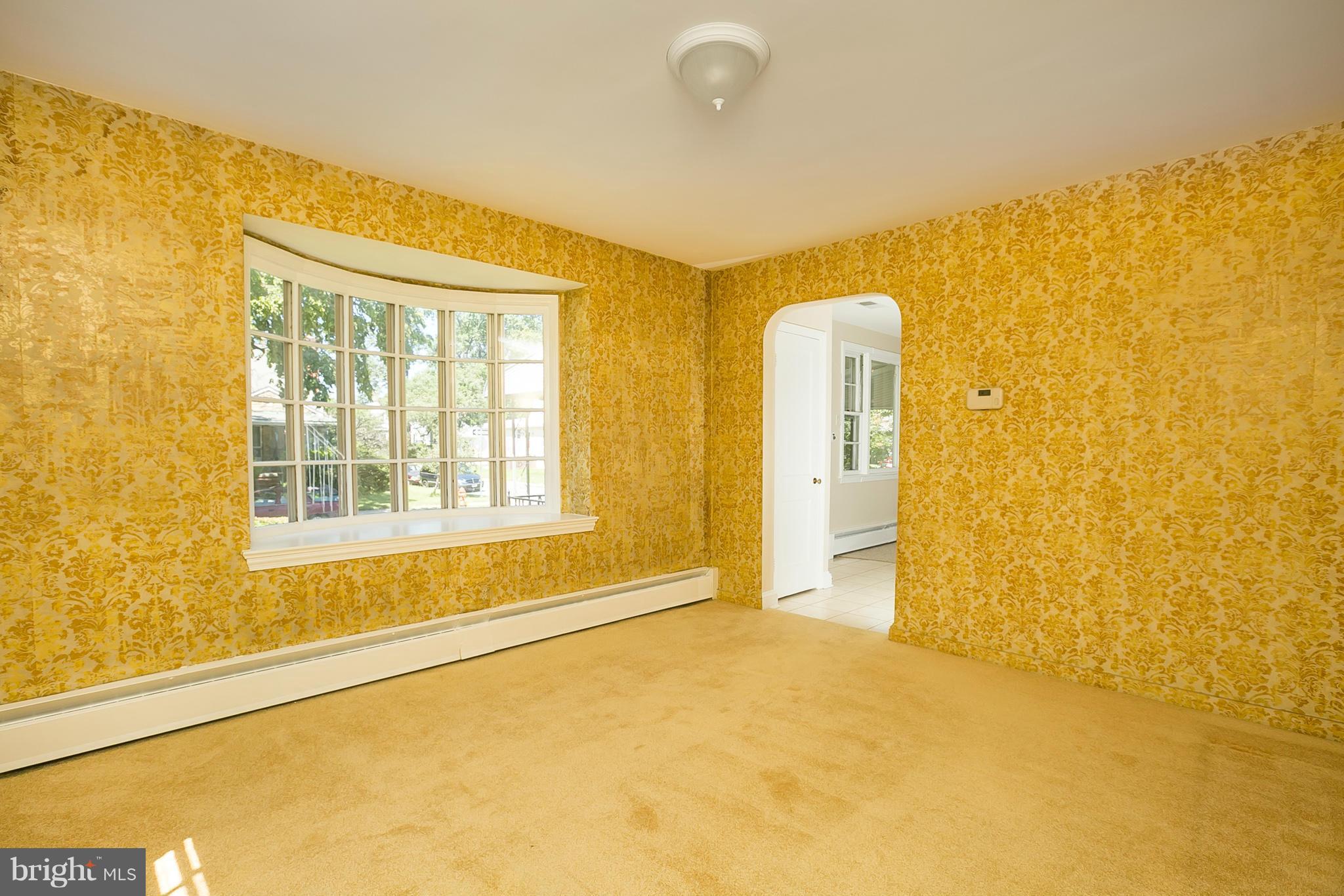 3301 Marnat Road Baltimore, MD 21208 - Photo 6 of 27 a view of an empty room with a window