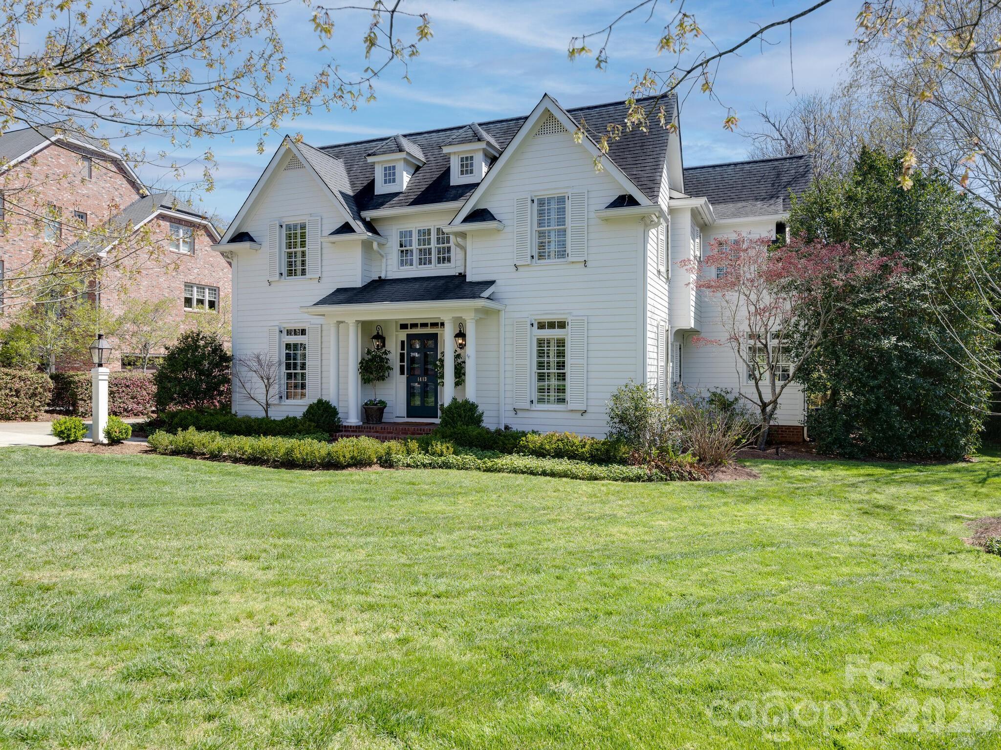 1413 Andover Road Charlotte, NC 28211 - Photo 2 of 41 a front view of a house with a yard