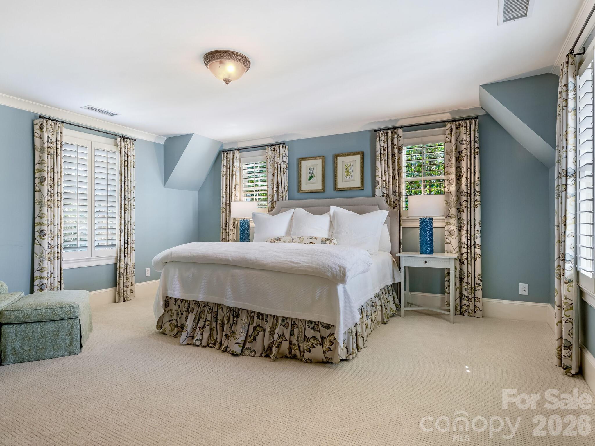 1413 Andover Road Charlotte, NC 28211 - Photo 23 of 41 a spacious bedroom with a bed and a cabinets