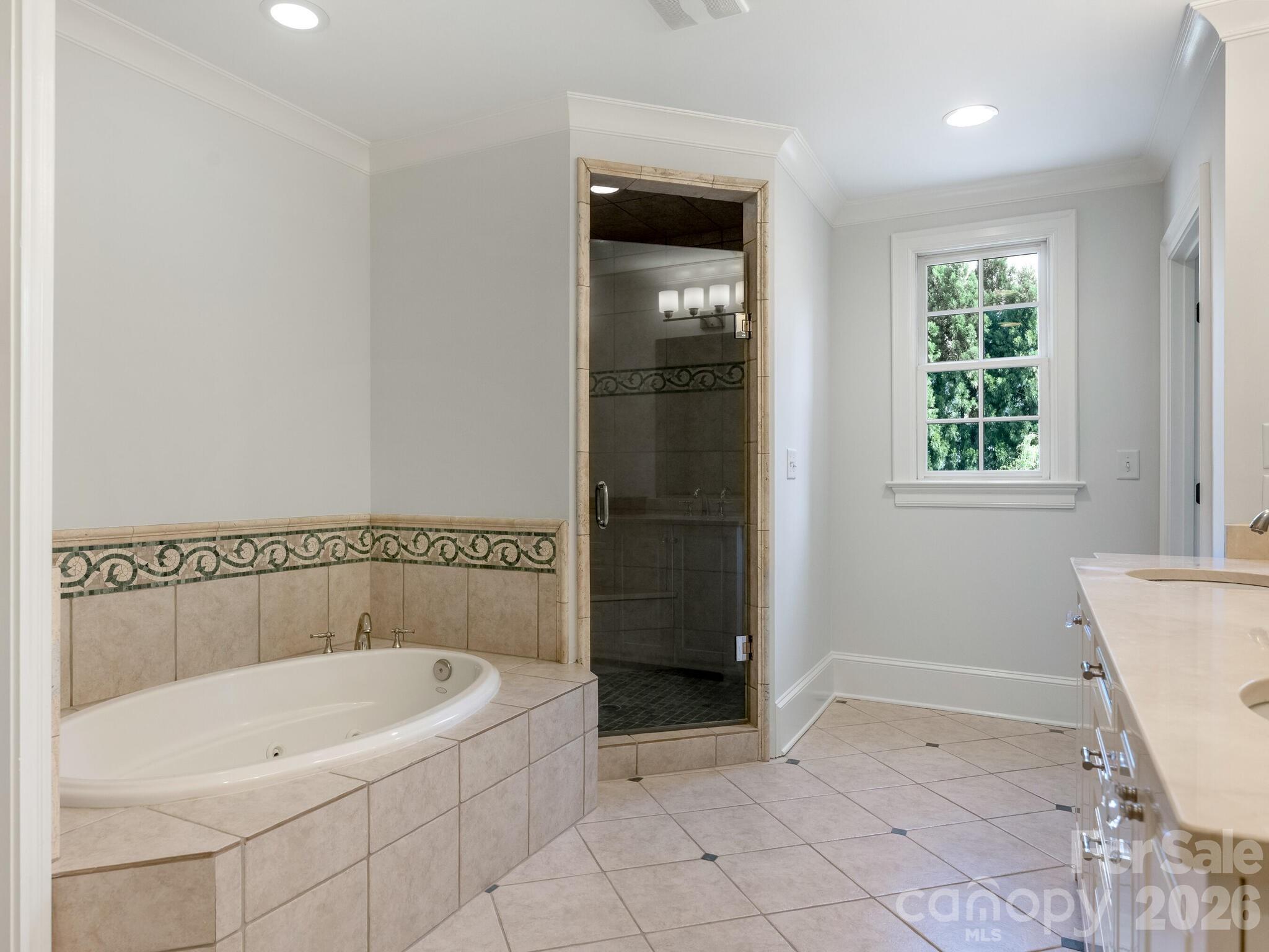 1413 Andover Road Charlotte, NC 28211 - Photo 26 of 41 a white bath tub sitting in a bathroom near shower