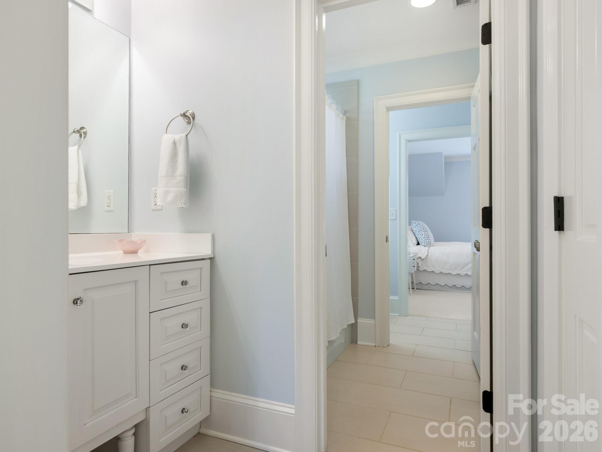 1413 Andover Road Charlotte, NC 28211 - Photo 28 of 41 a en suite bathroom with a toilet sink shower and mirror