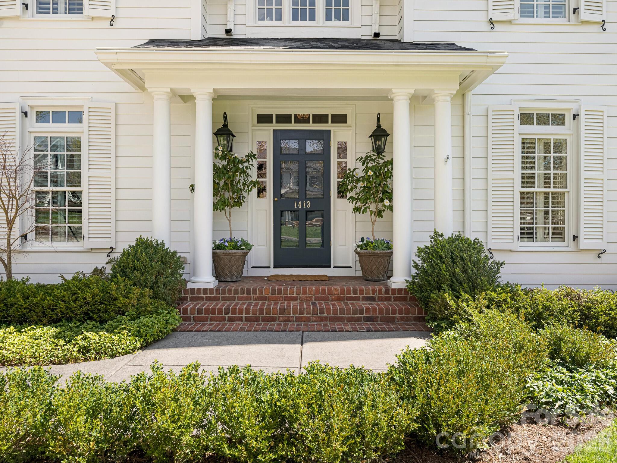 1413 Andover Road Charlotte, NC 28211 - Photo 3 of 41 a view of a house with potted plants