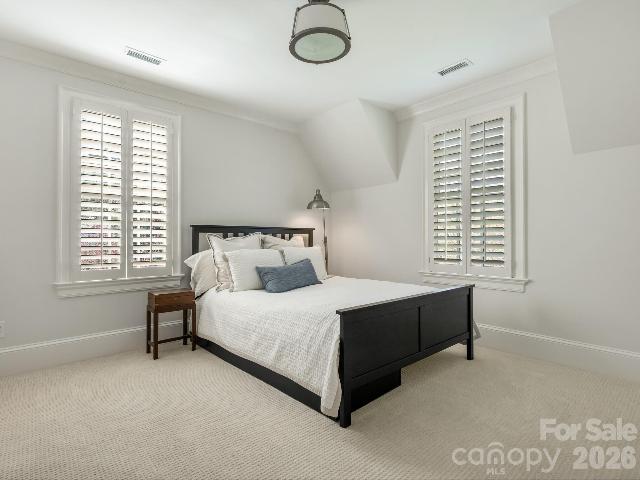 1413 Andover Road Charlotte, NC 28211 - Photo 31 of 41 a bedroom with a bed lamp and window