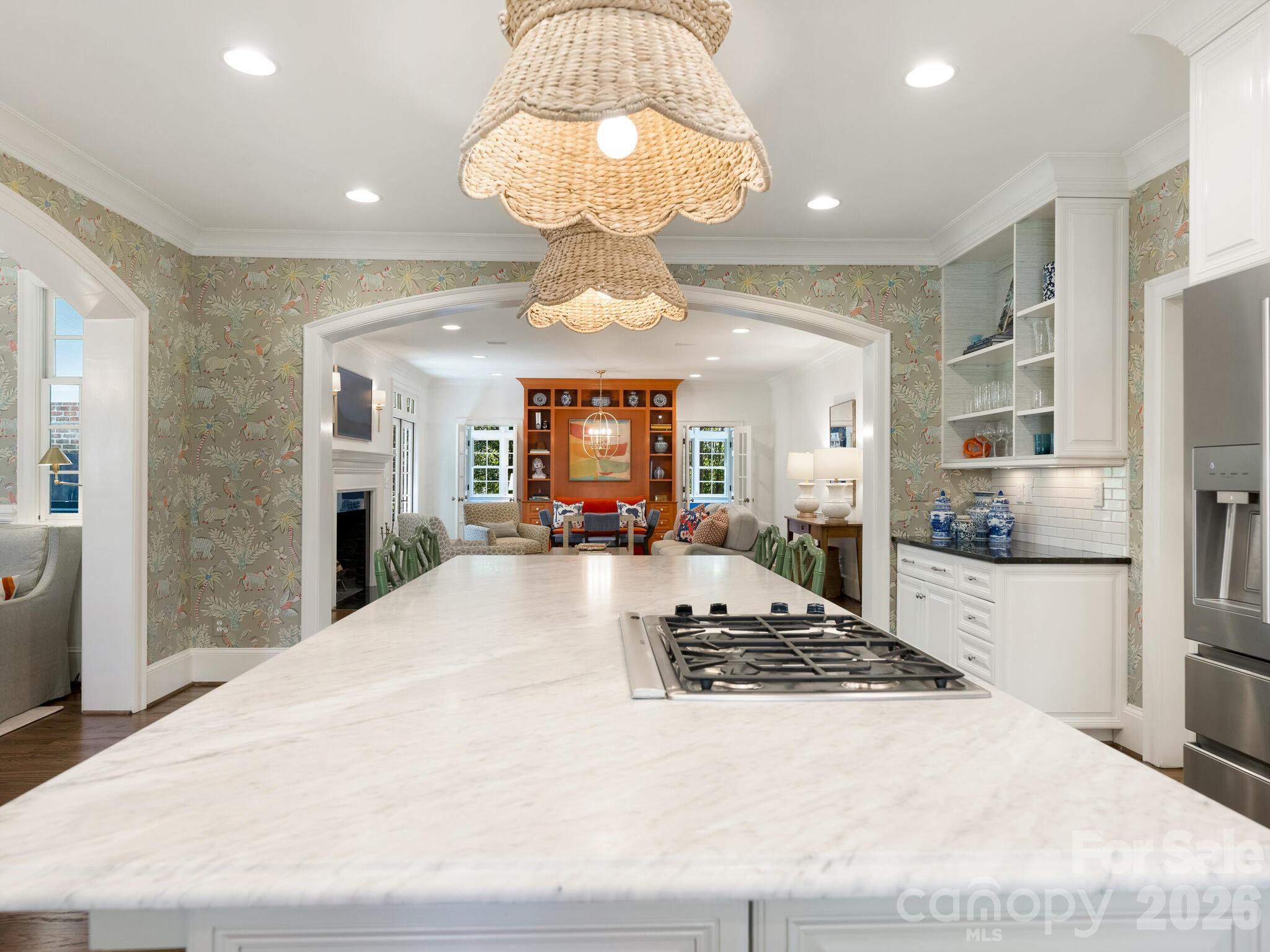 1413 Andover Road Charlotte, NC 28211 - Photo 10 of 41 a large white kitchen with kitchen island granite countertop wooden floor and stainless steel appliances