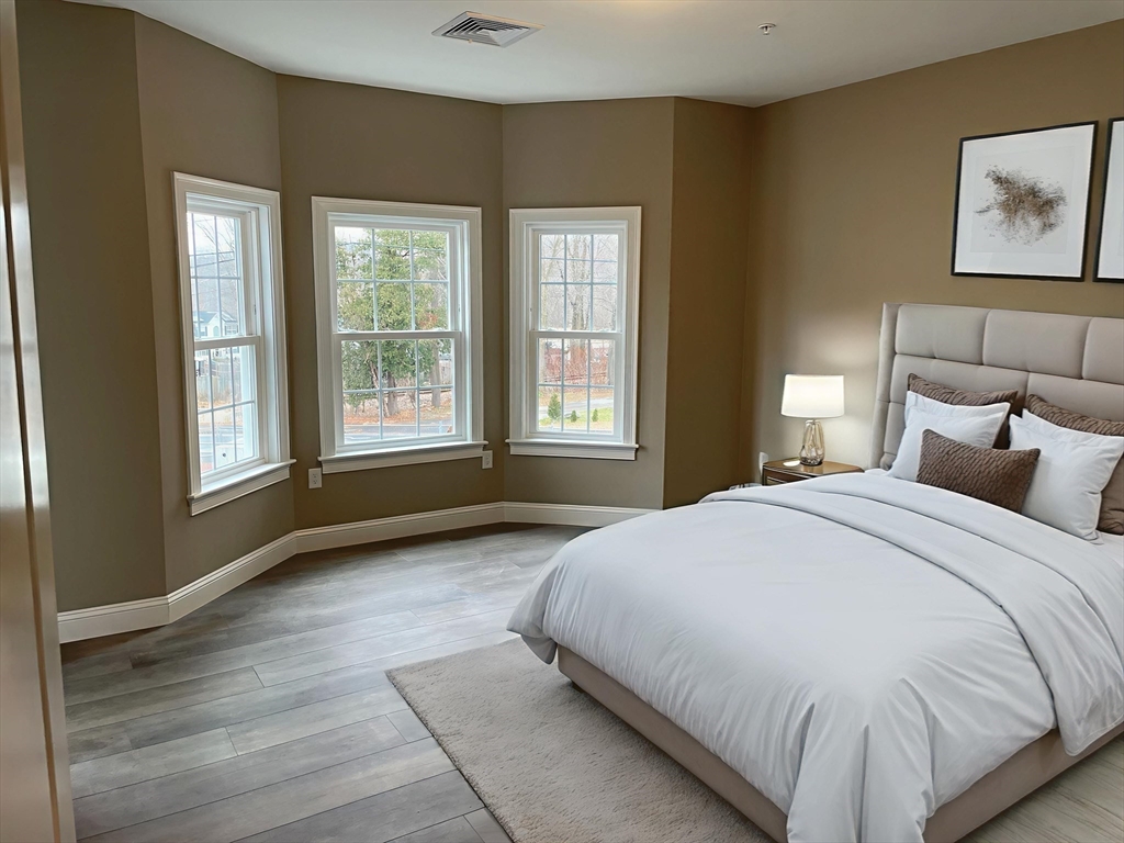 1 Brattle Street, Unit 4 Worcester, MA 01606 - Photo 14 of 21 a bedroom with a bed and a large window