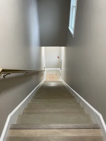 a view of yard with a car parked on the road