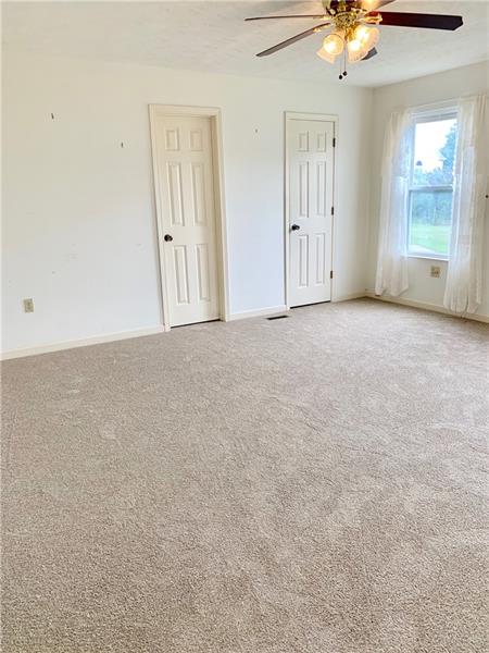 43 Peters Road Greensburg, PA 15601 - Photo 11 of 25 MASTER BEDROOM IS ON THE MAIN LEVEL WITH WALK IN CLOSET AND PRIVATE BATH. CEILING LIGHT FAN, NEW NEUTRAL CARPETING AND WALLS