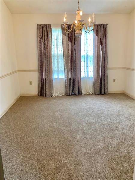 43 Peters Road Greensburg, PA 15601 - Photo 4 of 25 DINING ROOM WITH 2 WINDOWS THAT FACE THE FRONT OF THE HOME W/NEUTRAL WALLS AND NEW CARPET