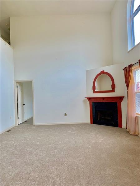 43 Peters Road Greensburg, PA 15601 - Photo 10 of 25 LIVING ROOM WITH VAULTED CEILINGS, NEW CARPETING, NEUTRAL WALLS AND A GAS FIREPLACE