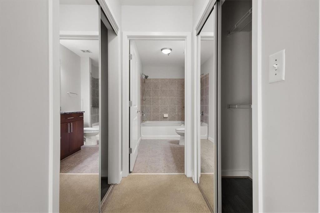 250 Pharr Road Northeast, Unit 309 Atlanta, GA 30305 - Photo 17 of 37 a view of a bathroom from a hallway