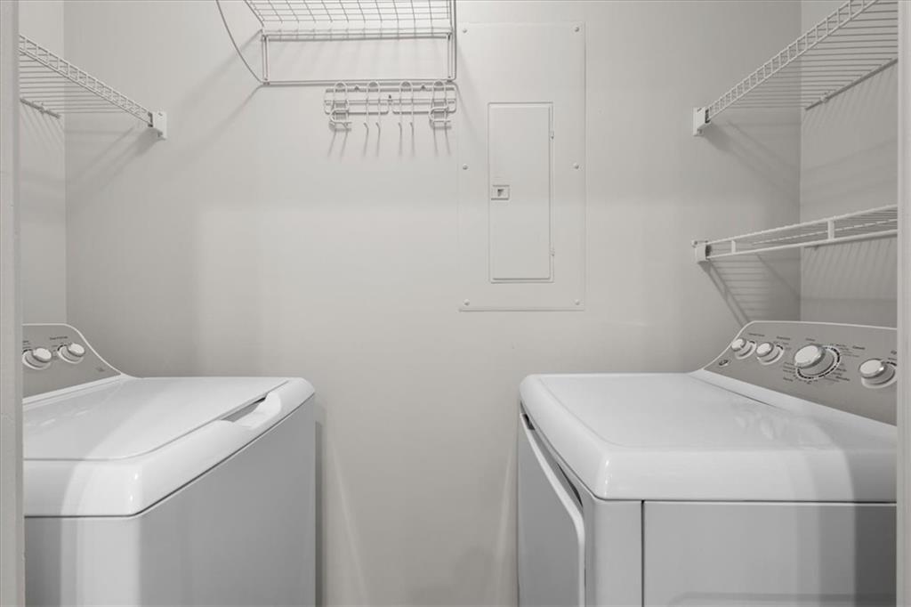250 Pharr Road Northeast, Unit 309 Atlanta, GA 30305 - Photo 19 of 37 a utility room with dryer and washer