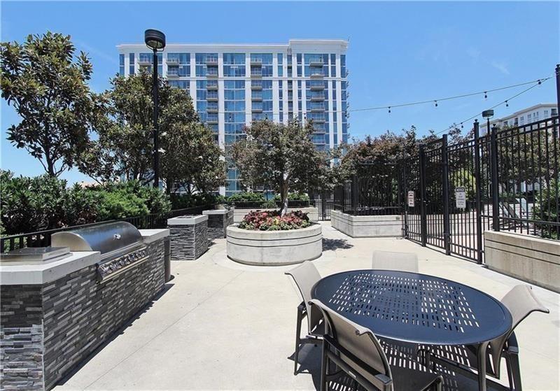 250 Pharr Road Northeast, Unit 309 Atlanta, GA 30305 - Photo 35 of 37 a outdoor living space with furniture and city view