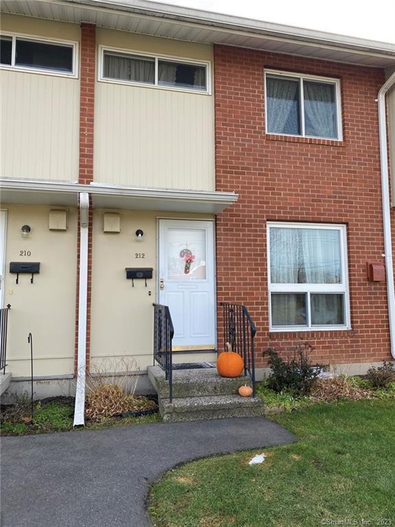 212 Centerbrook Road Hamden, CT 06518 - Photo 1 of 1 The front view of the unit features a clean and simple look with the brick and wood siding