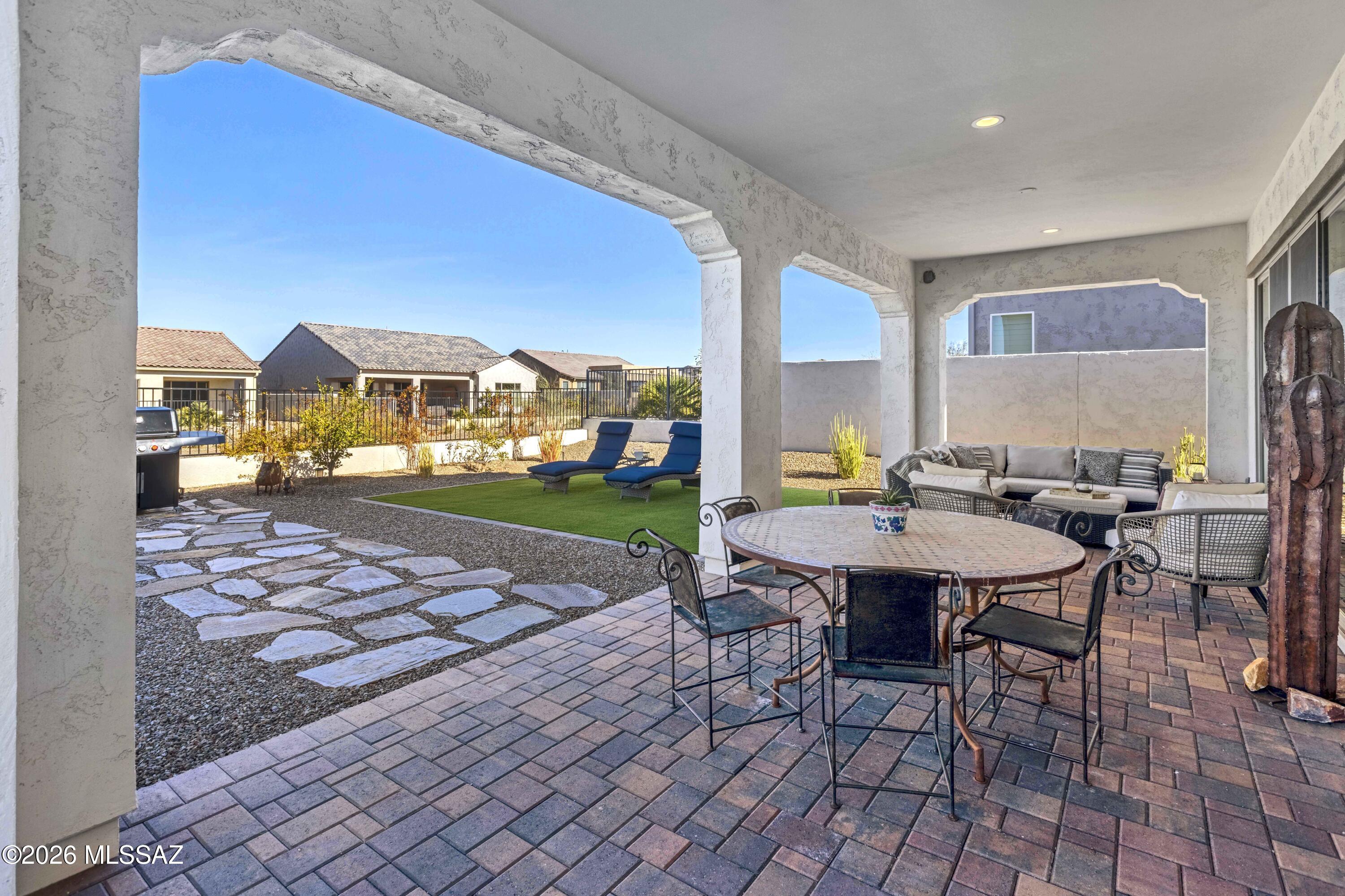 61460 East Shale Road Oracle, AZ 85623 - Photo 5 of 33 a view of a patio with a table and chairs
