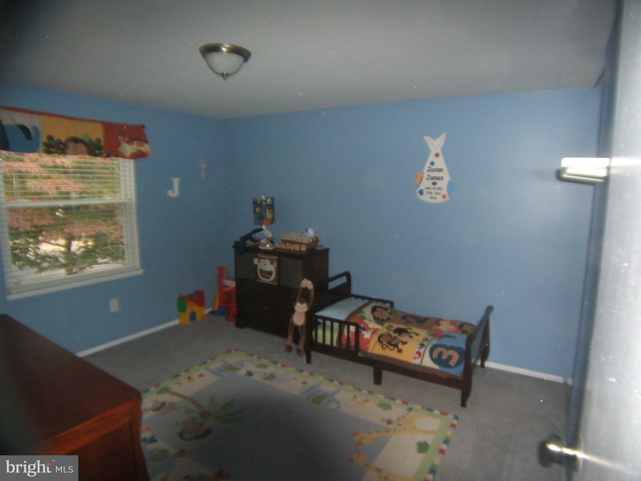19113 Staleybridge Road Germantown, MD 20876 - Photo 6 of 17 a bedroom with bed and window