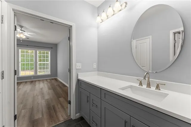 a bathroom with a double vanity sink and a mirror