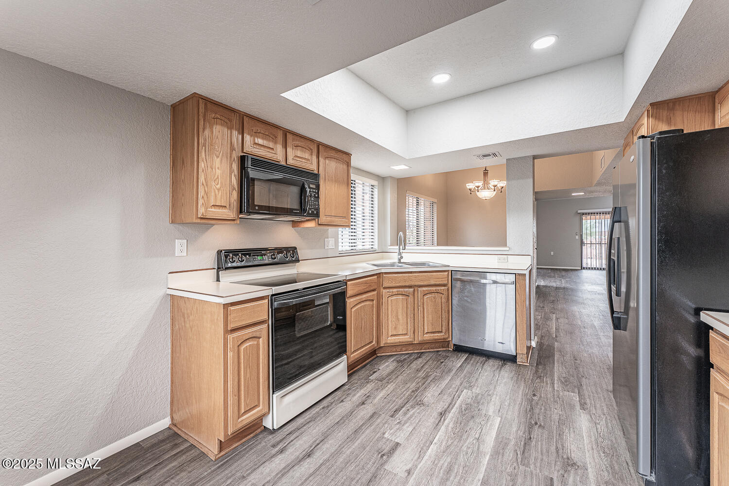 931 West Rio Guaymas Green Valley, AZ 85614 - Photo 11 of 39 a kitchen with granite countertop a stove top oven and sink