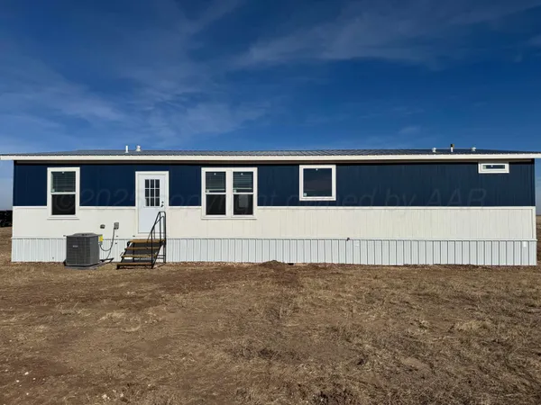 a view of house with yard