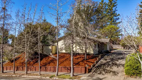 a balcony with trees in front of it