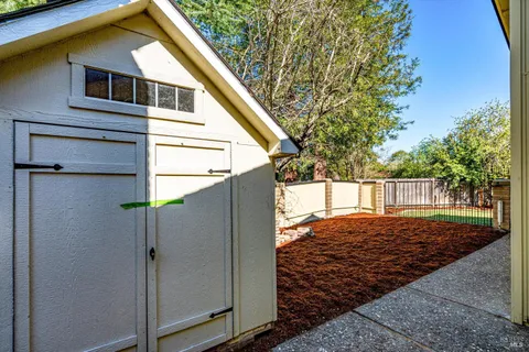 a view of a backyard with a small cabin