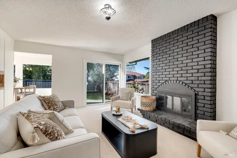 a living room with furniture and window