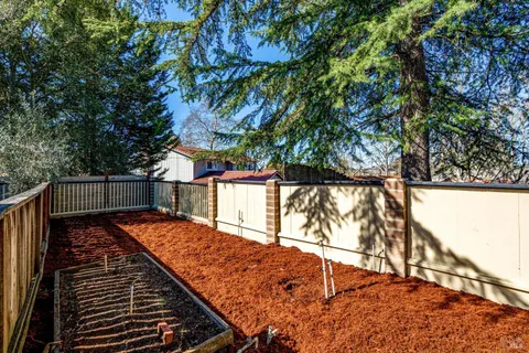a balcony with trees in front of it