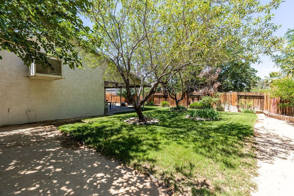 324 East Upjohn Avenue Ridgecrest, CA 93555 - Photo 34 of 35 a backyard of a house with lots of green space