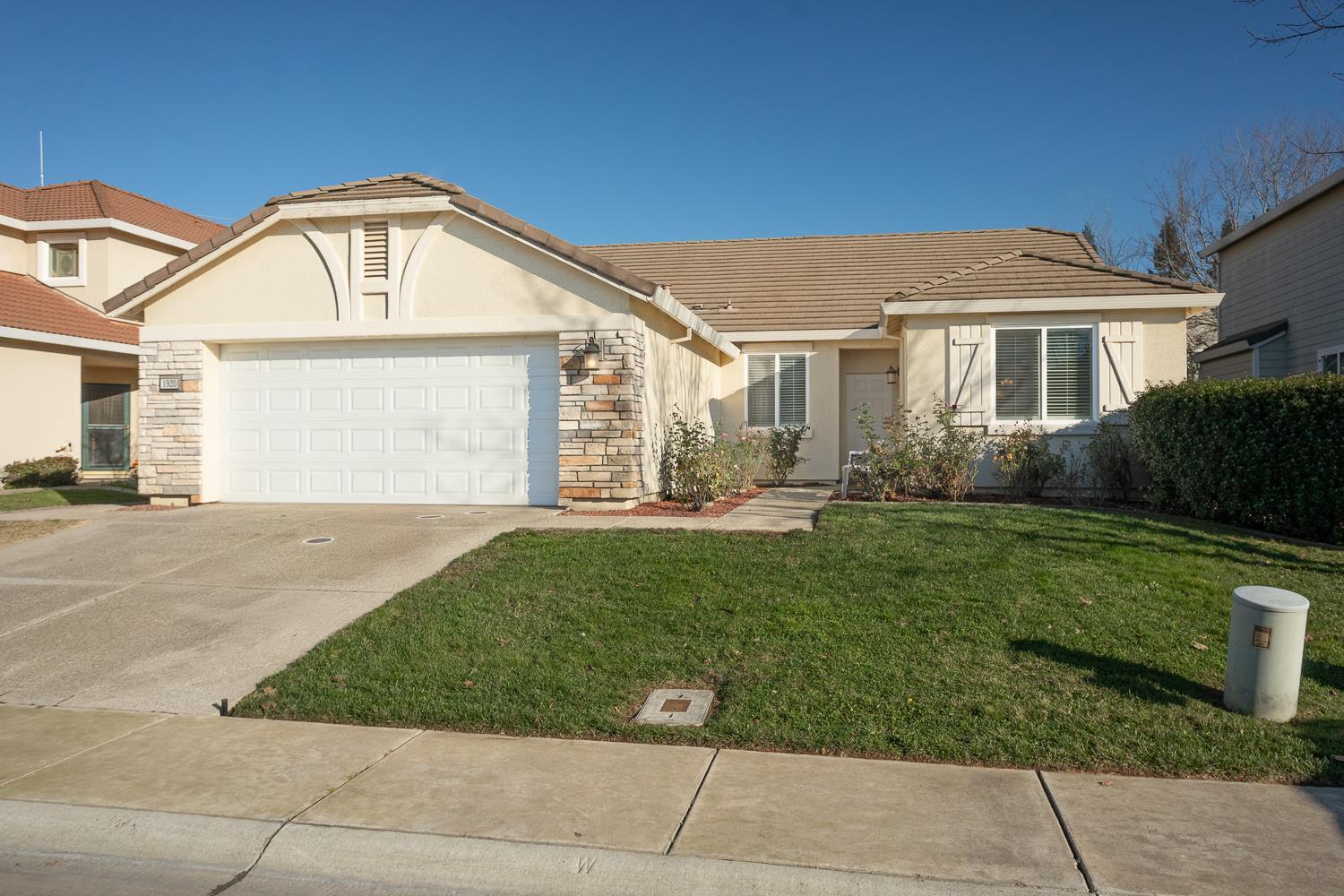 1920 Indiana Street Gridley, CA 95948 - Photo 12 of 66 a front view of a house with garden
