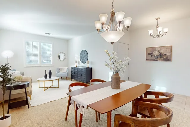 a kitchen with stainless steel appliances granite countertop a refrigerator a sink a stove a microwave and island