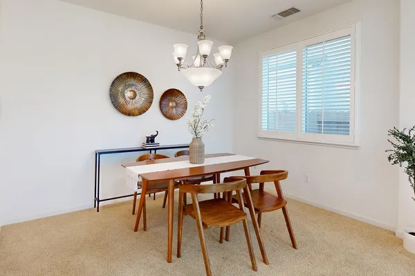 a kitchen with stainless steel appliances granite countertop a sink a stove and a refrigerator
