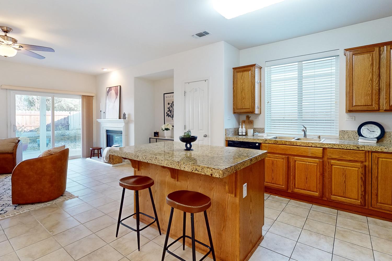 1920 Indiana Street Gridley, CA 95948 - Photo 26 of 66 a kitchen with stainless steel appliances granite countertop a sink a stove and a refrigerator