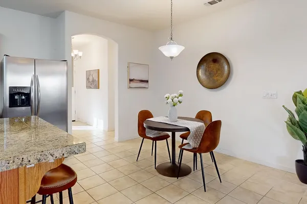a bedroom with a bed and a chair