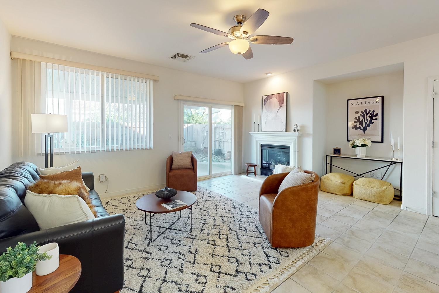 1920 Indiana Street Gridley, CA 95948 - Photo 37 of 66 a living room with furniture a fireplace and a flat screen tv