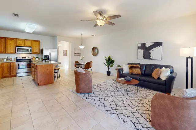 a view of a livingroom with furniture and a window
