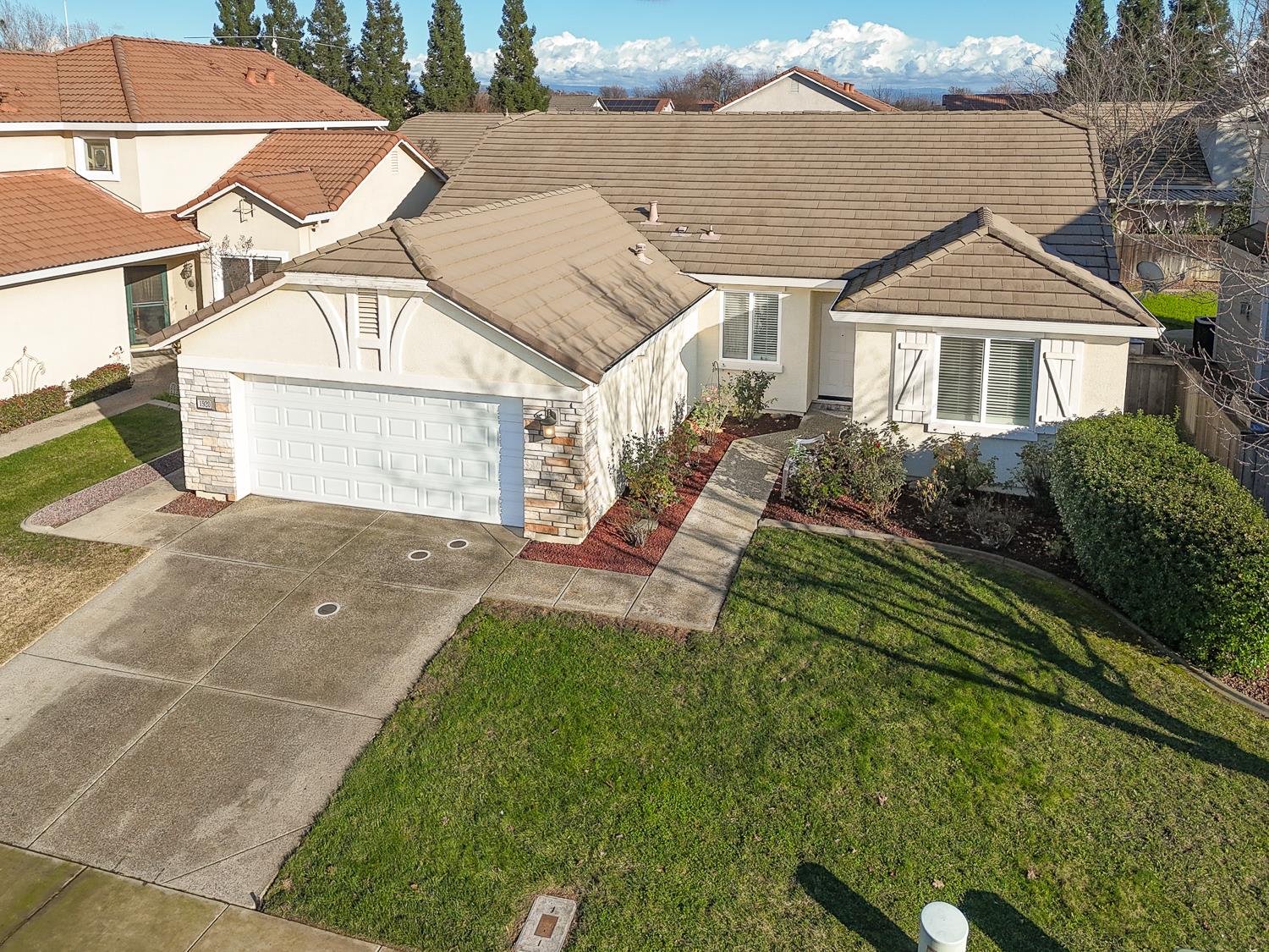 1920 Indiana Street Gridley, CA 95948 - Photo 4 of 66 a front view of a house with a yard and potted plants