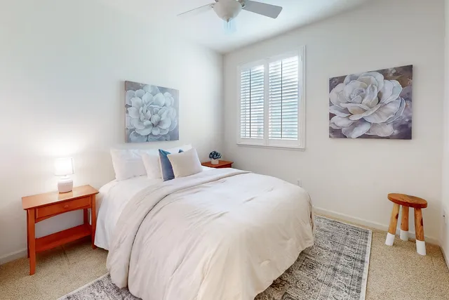 a backyard of a house with outdoor seating