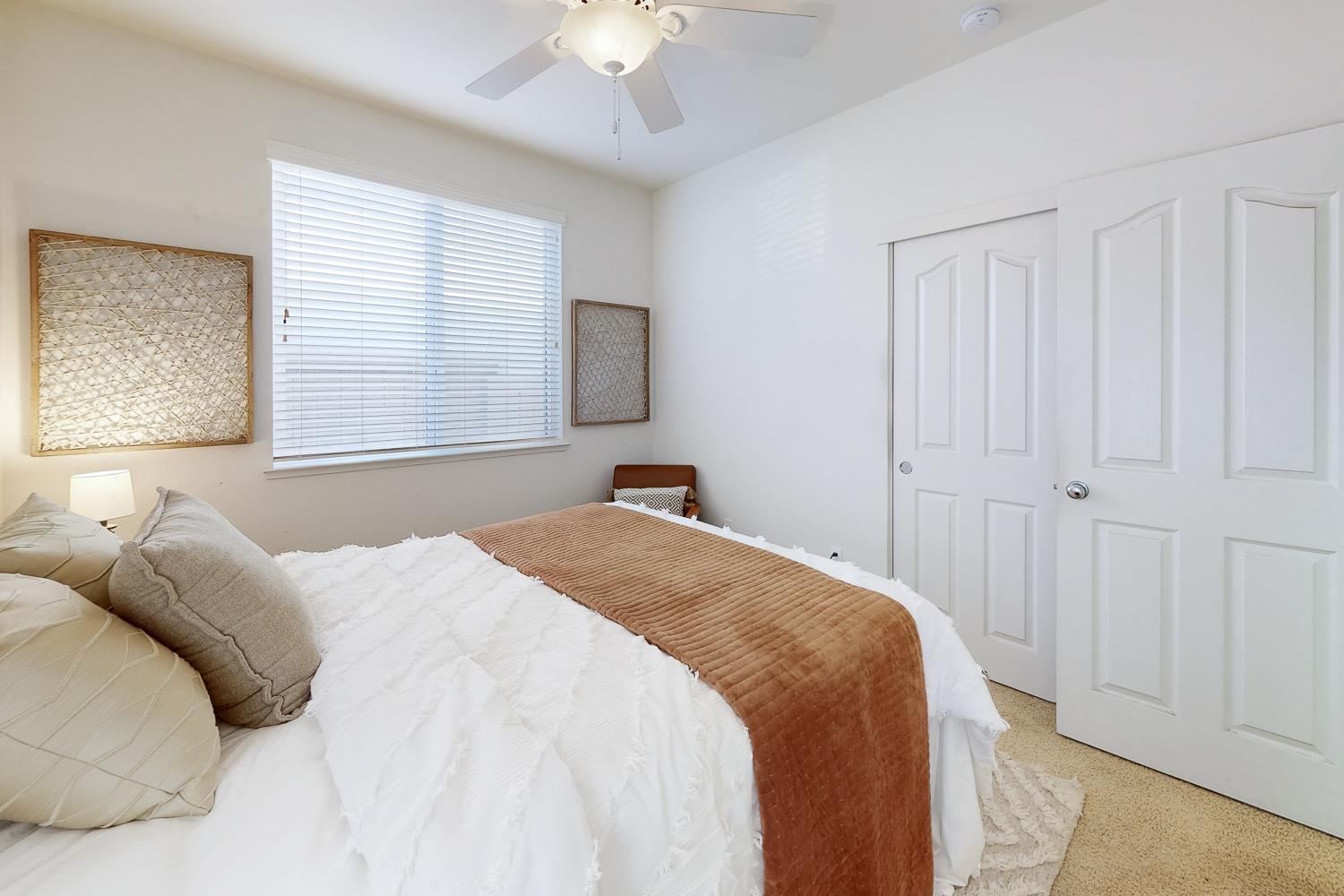 1920 Indiana Street Gridley, CA 95948 - Photo 47 of 66 a bedroom with a large bed and a chandelier