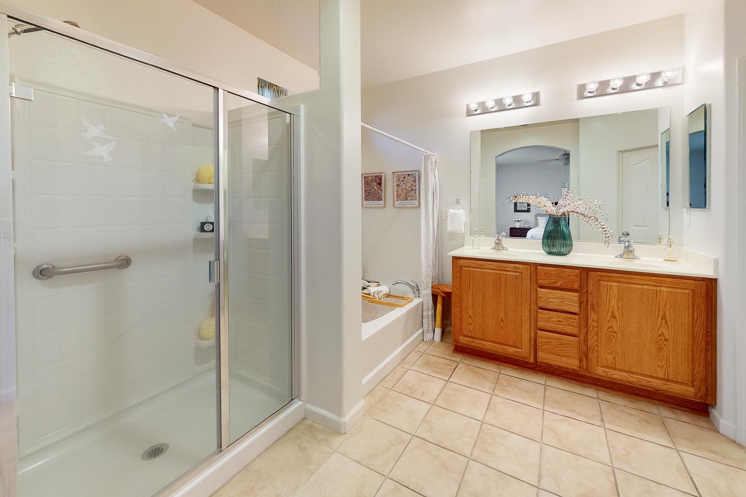 1920 Indiana Street Gridley, CA 95948 - Photo 53 of 66 a bathroom with a double vanity sink mirror and shower
