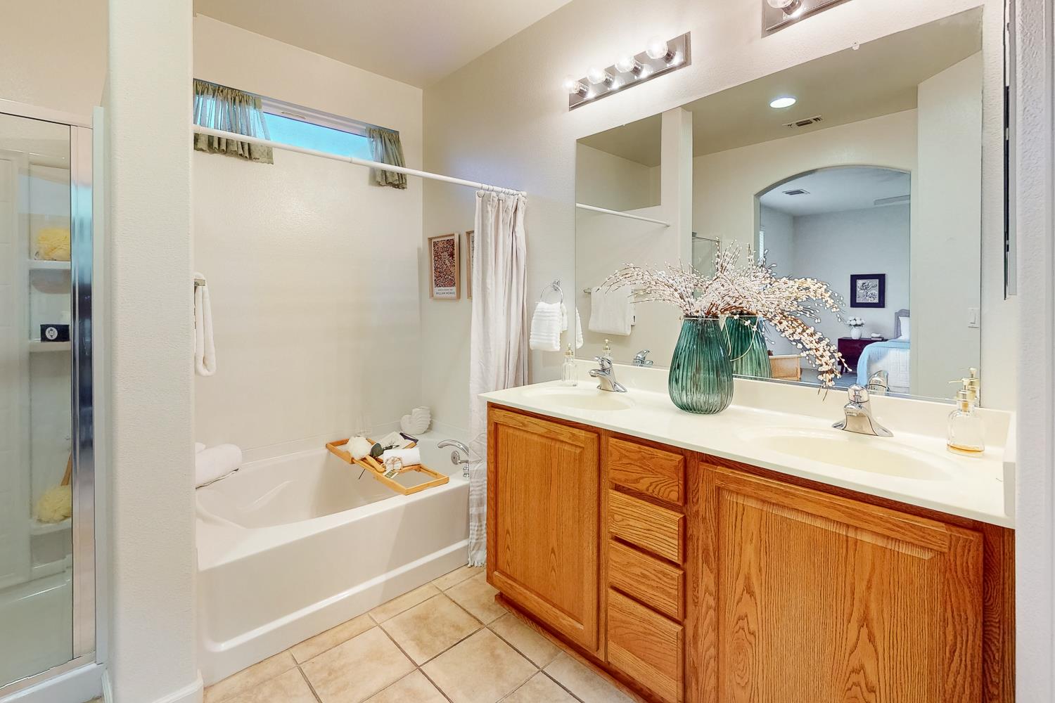 1920 Indiana Street Gridley, CA 95948 - Photo 55 of 66 a bathroom with a granite countertop sink mirror and a