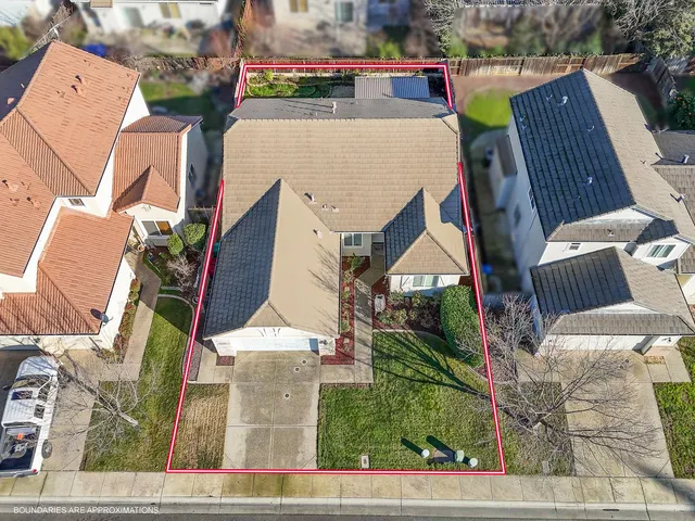 an aerial view of house with yard