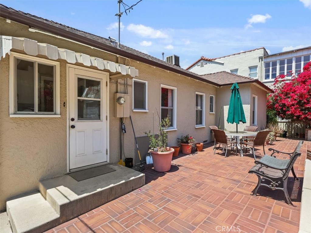 945 Rosemount Road Glendale, CA 91207 - Photo 9 of 31 a view of a patio with couches table and chairs and potted plants