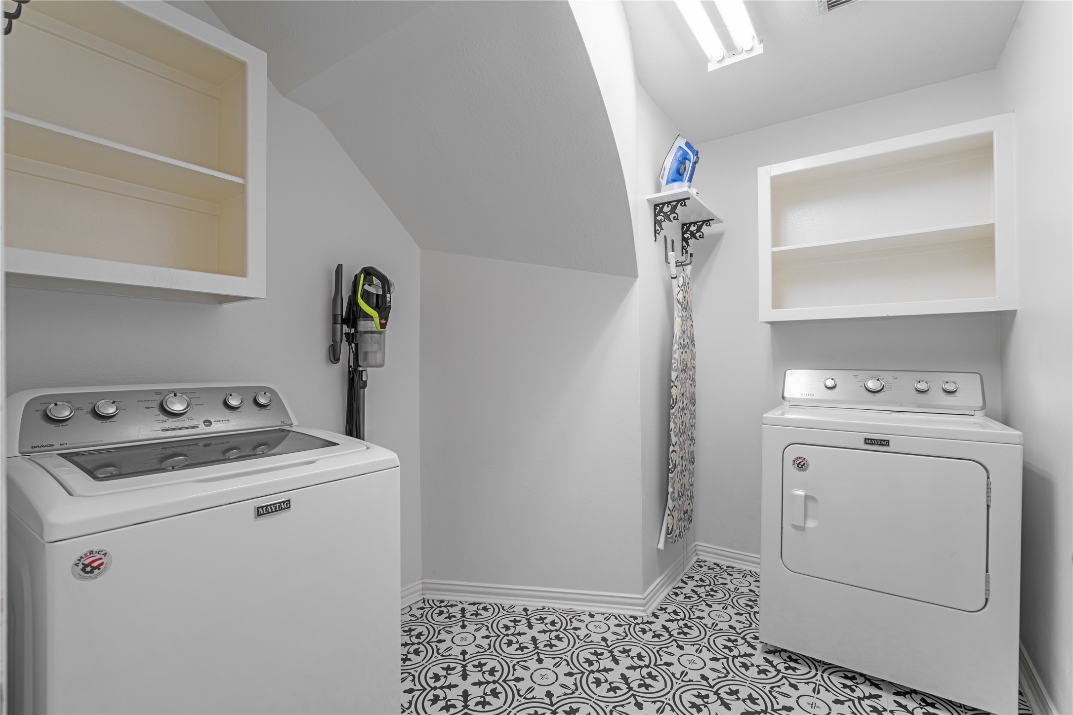 14718 Ramblebrook Humble, TX 77396 - Photo 26 of 38 A comfortable laundry room with a separate washer and dryer setup, offering practical space for everyday routines.