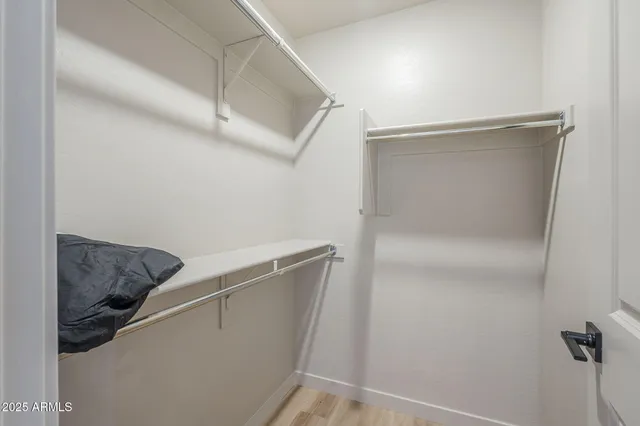 a view of storage and utility room with closet