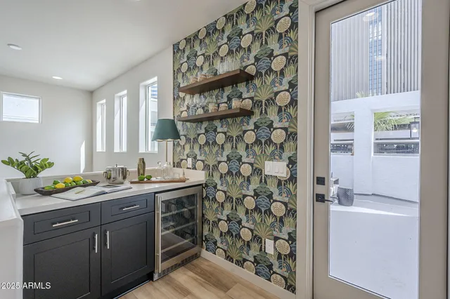 a utility room with cabinets and window