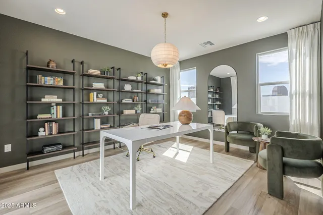 a workspace with furniture window and wooden floor