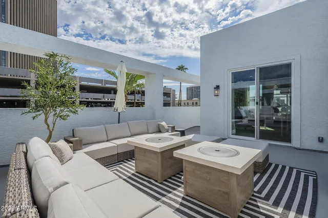 a outdoor living space with furniture and potted plants
