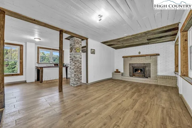 a kitchen with stainless steel appliances granite countertop a refrigerator and a stove
